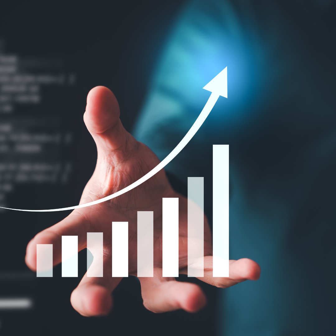 Hand presenting rising bar chart with upward arrow symbolising business growth, data analytics, and revenue performance increase